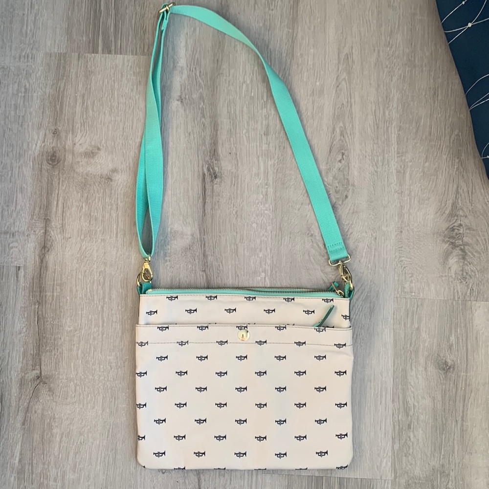 Unworn Fossil crossbody purse with trumpets.